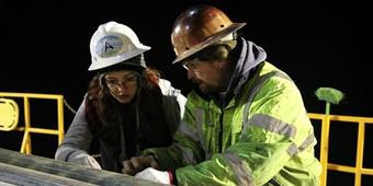 Professor Abbott with a student in the field